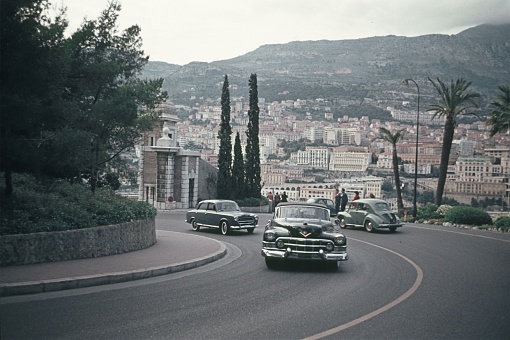 Monaco, 1962. Street scene with a Limousine (cars), tourists and buildings in Monaco.