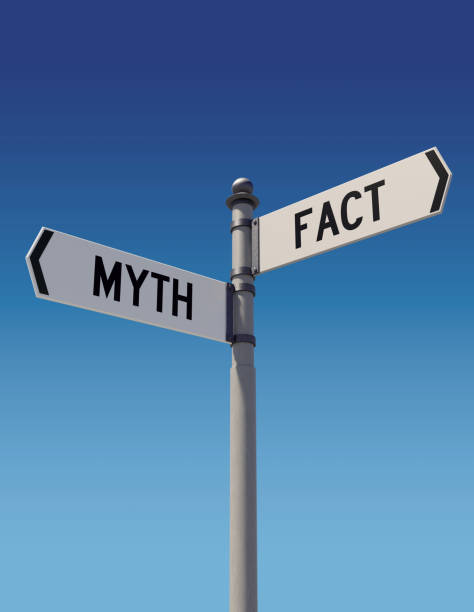 Street signs pointing opposite directions: Myth or Fact. Street signs against clear blue sky pointing opposite directions: Myth or Fact. Dilemma and choice concept. Vertical composition with copy space. Clipping path is included. mythology stock pictures, royalty-free photos & images
