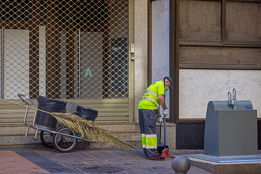 Street sweeper at work in a pedestrian street in the central Santa Cruz which is the main city on the Spanish Canary Island Tenerife