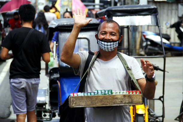 Street vendor sell cigarettes after quarantine rules were eased up during Covid 19 virus outbreak stock photo