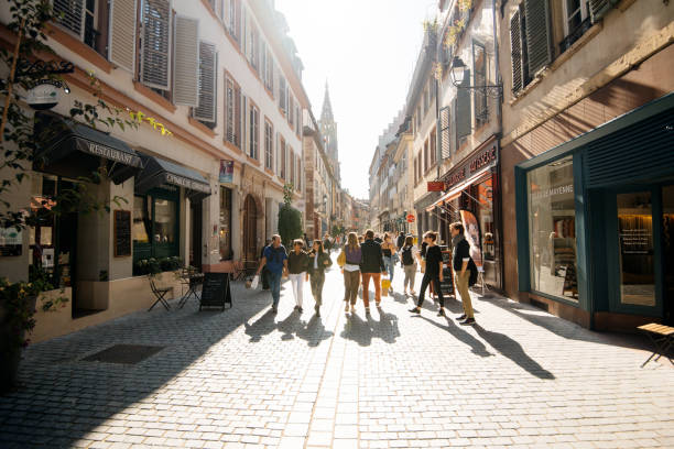 Street view cityscape of Rue des Juifs Strasbourg Strasbourg, France - Sep 21, 2019: Street view cityscape of Rue des Juifs street with shops people restaurants and Notre-Dame de Strasbourg cathedral in background notre dame de strasbourg stock pictures, royalty-free photos & images