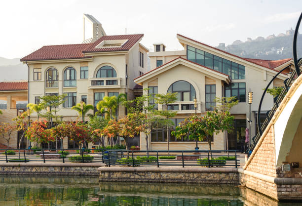 Street with beautiful villas on the bank of the canal in Shenzhen, China stock photo