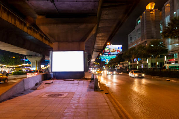 Streets with advertising and heavy traffic at night Bangkok Thailand. stock photo
