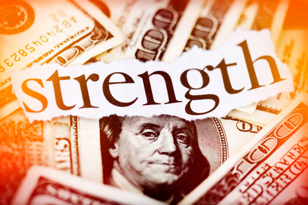 Strength Hundred dollar bills with the word "Strencth." Dow Futures  stock pictures, royalty-free photos & images