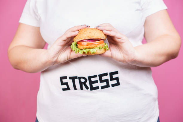 stress, fast food, bulimia, compulsive overeating - come e sente imagens e fotografias de stock