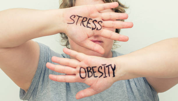 Stress. Overweight woman. Eating problems. Bulimia, compulsive overeating. Sugar addiction, weight gain. stock photo