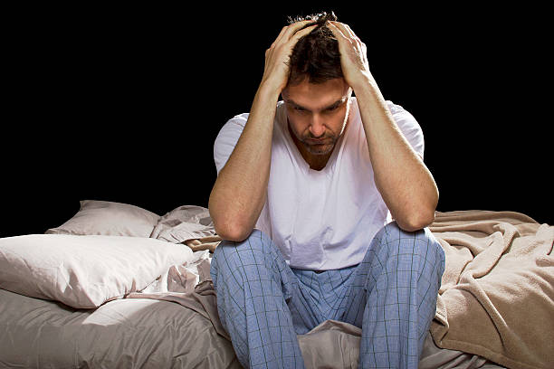 Stressed Out Man Staying Up Awake Suffering From Insomnia stock photo