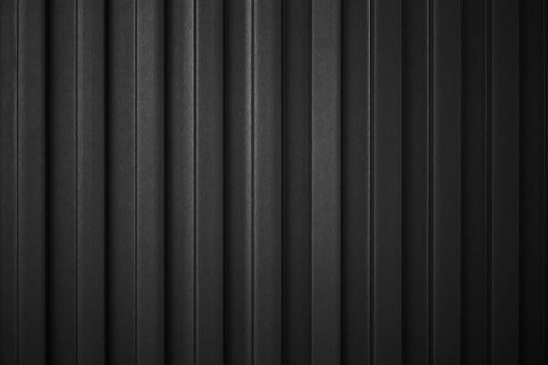 Striped Black wave steel metal sheet cargo container line industry wall texture pattern for background. stock photo