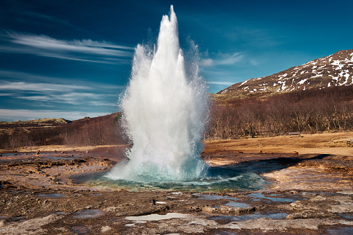 The erupting Stokkur geyser on a sunny day, Located in the Golden Circle route, Iceland
