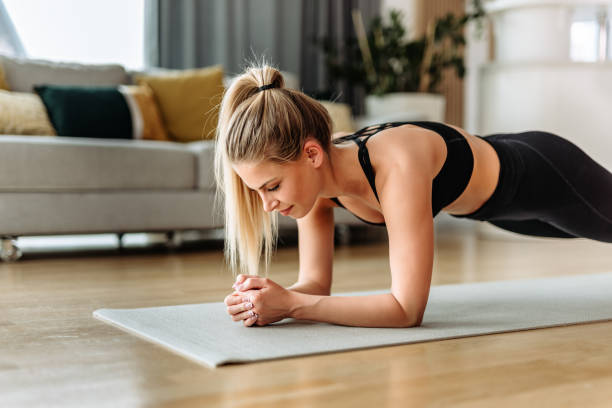 Strong girl, doing exercise for abs. stock photo