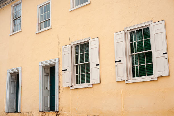 stucco wall of unoccupied colonial style building stock photo