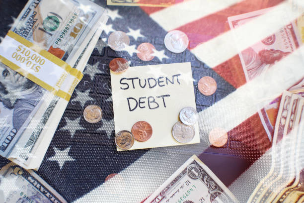 Student Debt Concept In The United States With Borrowed Money With The American Flag High Quality Student Debt Concept In The United States With Borrowed Money With The American Flag student debt stock pictures, royalty-free photos & images