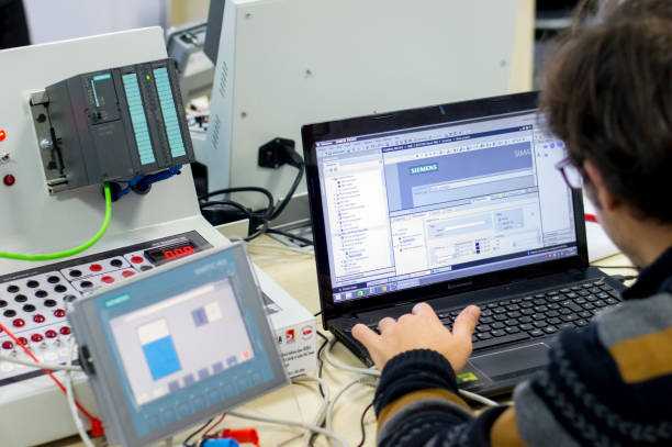 Student is taking PLC and SCADA course for Industry 4.0 stock photo