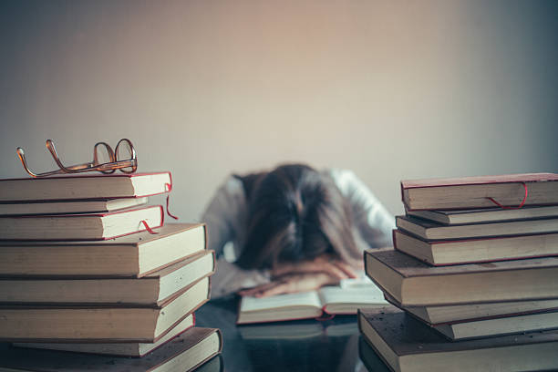 Student Studying Sleeping on Books Student Studying Sleeping on Books, Tired Girl Read Book, Library hardest exams stock pictures, royalty-free photos & images