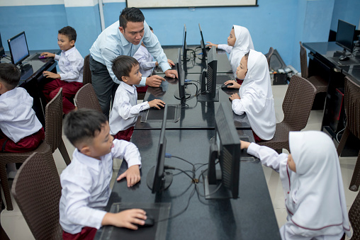 Students and Teachers study in computer lab