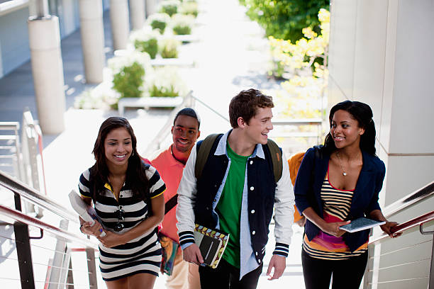 Students climbing steps together  public universities in usa stock pictures, royalty-free photos & images