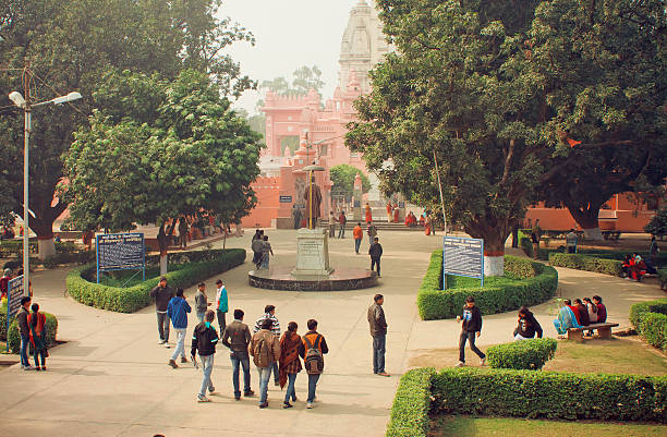 Students go to campus through park stock photo