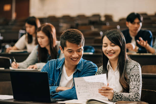 students in lecture hall Studying abroad in international campus in East Asia - excellent opportunity for graduates and post graduates to achieve excellence in education and research students exam results stock pictures, royalty-free photos & images