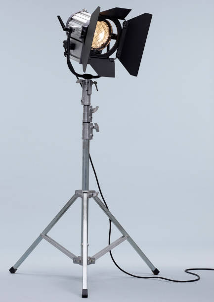Studio Light on a metal stand. Black Studio Light used in Films or Movies on a metal stand isolated on white background staging light stock pictures, royalty-free photos & images