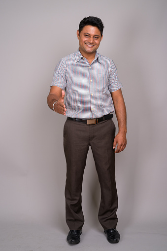 Studio Shot Of Young Indian Man Wearing Smart Casual Clothes