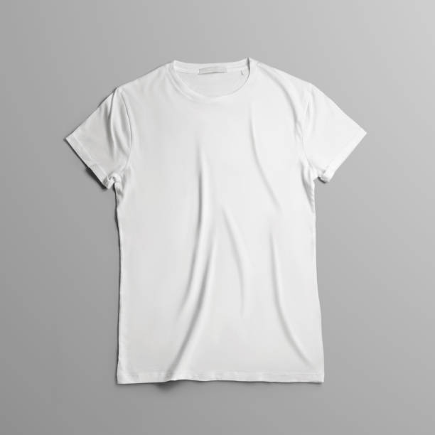 Studio template of clothes with  blank t-shirt lies on the on gray background. stock photo