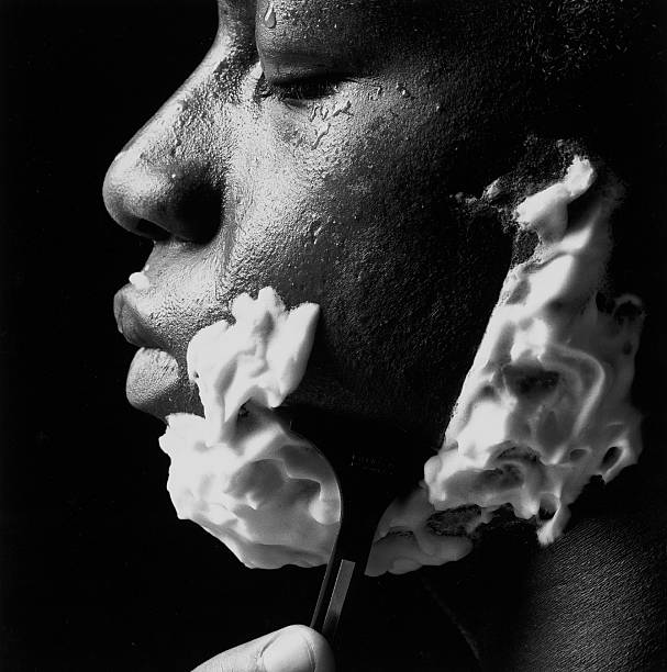 Study in black and white : African American man shaving stock photo