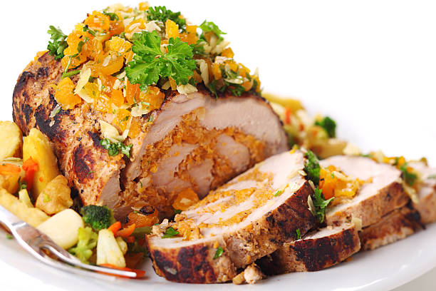 Stuffed pork roast with dried apricots and nuts. stock photo