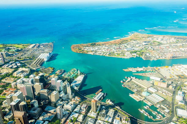 stunning aerial view of the Honolulu city Absolutely stunning aerial view of the Honolulu city from a jet plane right next to the Pearl Harbour honolulu stock pictures, royalty-free photos & images