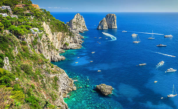 Stunning Capri island, beach and Faraglioni cliffs, Italy, Europe stock photo
