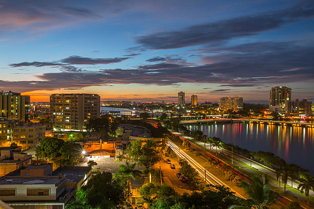 Stunning sunset in San Juan, Puerto Rico Vast and expansive view of the San Juan Bay, Condado Lagoon and the city of San Juan, Puerto Rico at sunset.   puerto rico stock pictures, royalty-free photos & images