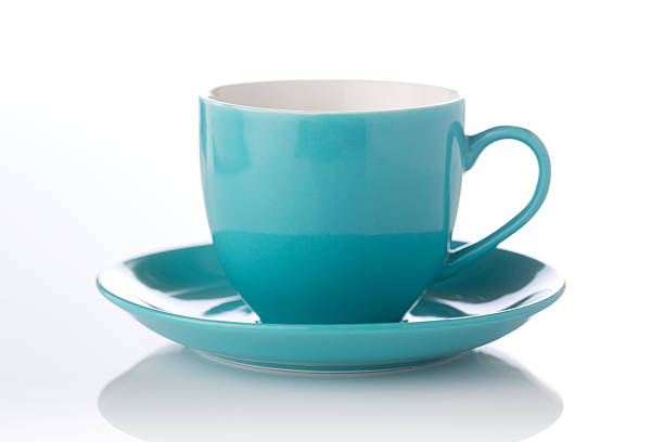 stylish teal color cup and saucer cup and saucer on white background tea cup stock pictures, royalty-free photos & images