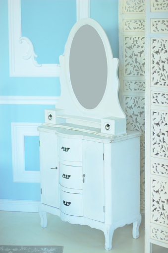 Stylish White Chest Of Drawers In A Luxurious Bedroom Stock Photo