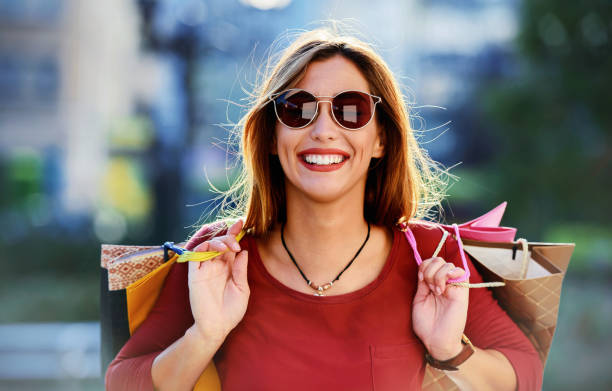 Stylish young woman enjoying in shopping. Consumerism, fashion, lifestyle concept stock photo