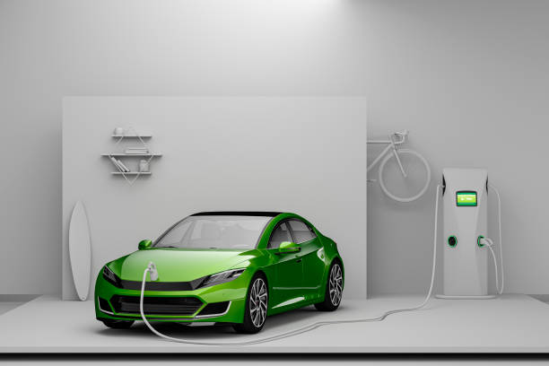 Stylized View Of A Generic Green Electric Car In A White Photography Studio With White Colored Props Being Charged By A Home Electric Vehicle Charging Station stock photo