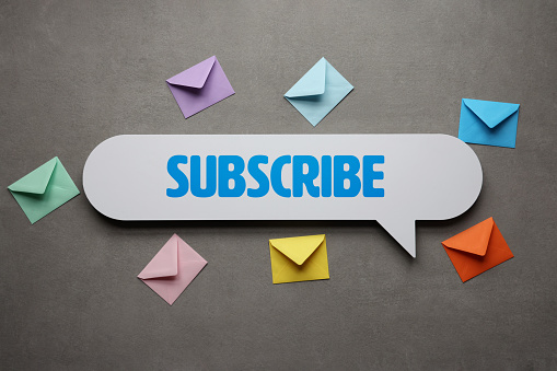 Subscribe text on speech bubble with envelopes
