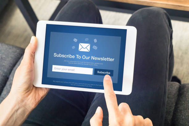 Subscribe to newsletter form on tablet computer screen to join list of susbscribers and receive exclusive offers and update. Digital communication marketing and email advertising. Membership sign-up stock photo