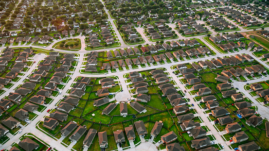 Aerial view of suburban residential area of tract housing in Houston, Texas, USA.