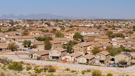 Aerial shot of housing in Vail, a suburb southeast of Tucson in Pima County, Arizona on a hazy day in spring.