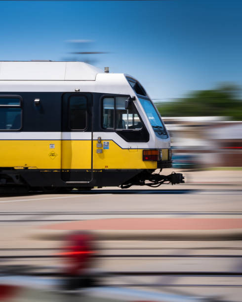 Subway Train in Action Moving Thru Suburban Area, Moving Railway Train with Motion Blur, Modern Public Transport at High Speed stock photo