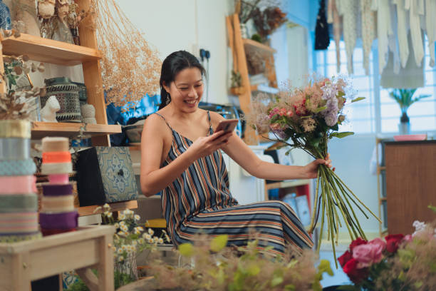 Successful self employed florist working from home stock photo