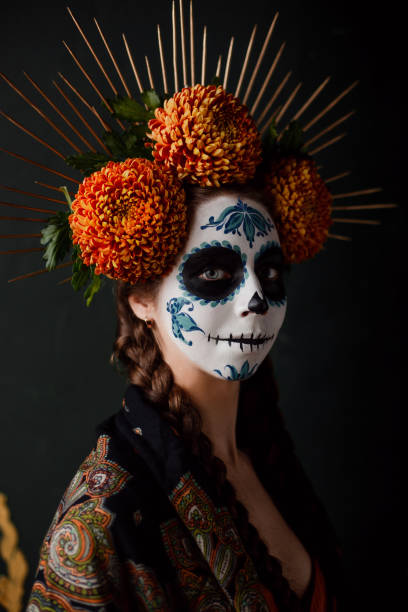 Sugar skull creative make up for halloween Portrait of young woman wearing makeup for Halloween inspired by the mexican celebration. fine art portrait stock pictures, royalty-free photos & images