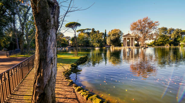 A suggestive and peaceful autumn view of the Lake of Villa Borghese in the green heart of Rome stock photo