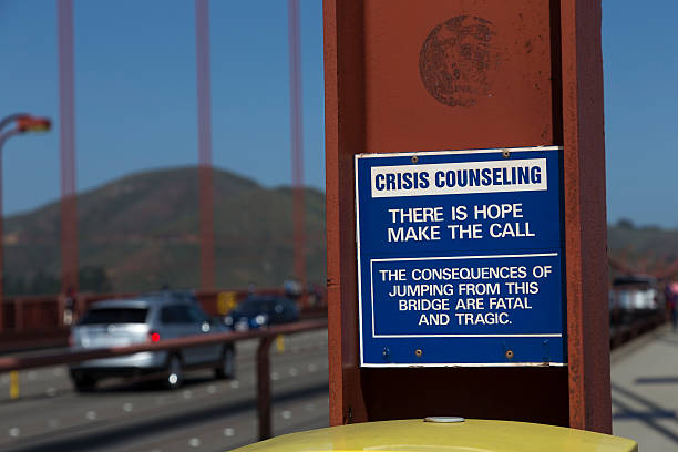 Suicide Prevention Sign on Golden Gate stock photo