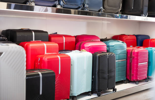 Suitcases in dry goods store. Shelving luggage. stock photo