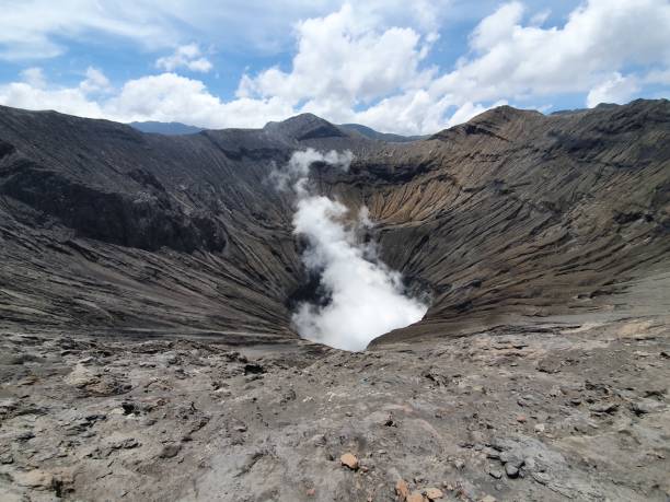 sulfurous gases inside a volcano crater - semeru stok fotoğraflar ve resimler