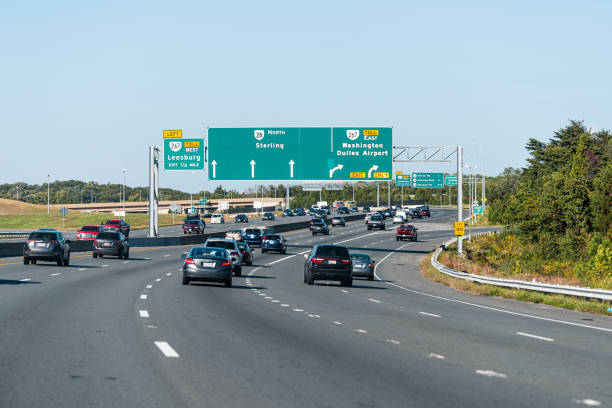 Sully road 28 multiple lane highway in Northern Virginia with traffic cars and exit sign for Washington Dulles airport stock photo