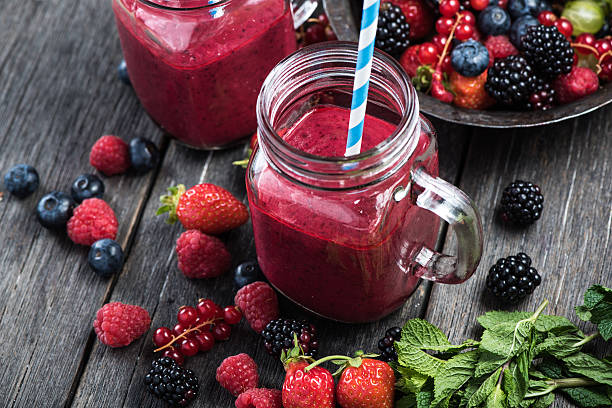 summer berries smoothie in mason jar - smoothie bildbanksfoton och bilder