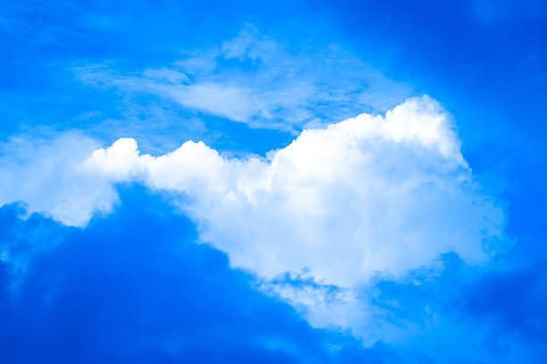 Summer clouds in a blue sky stock photo