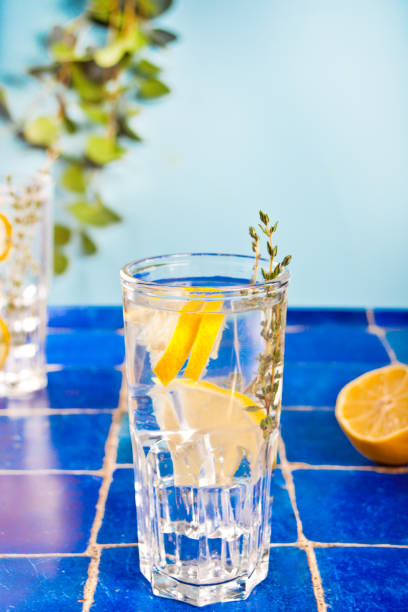 Summer cold fresh lemonade with herb thyme and lemon stock photo