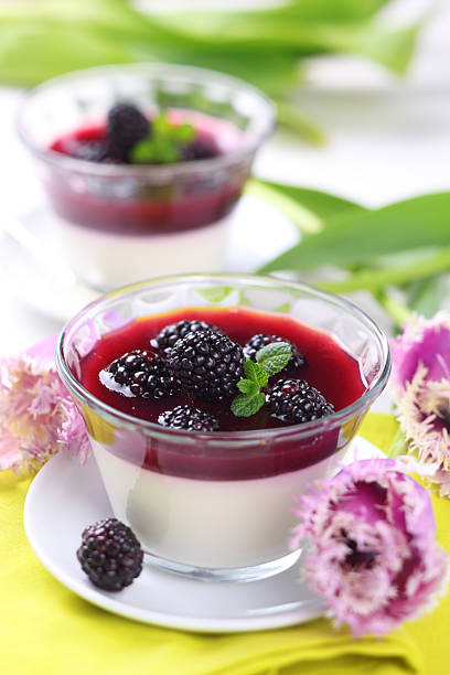 summer dessert with blackberries and cream stock photo